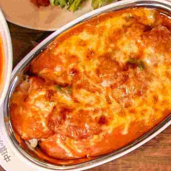 Baked cheese and pork chop with tomato sauce on fried rice
